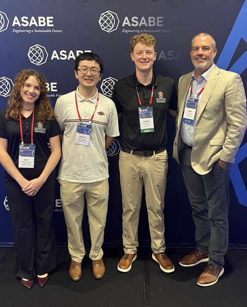 Sam and SAFE Lab members at the ASABE conference